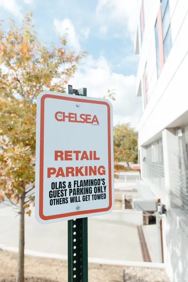 The retail parking sign at 12 south: olas & flamingo guest parking only
